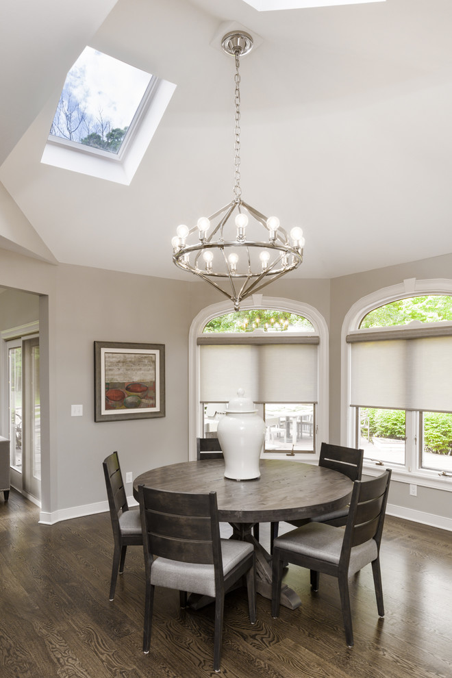 This is an example of a mid-sized modern separate dining room in Cleveland with grey walls and dark hardwood floors.