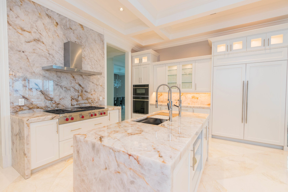 Inspiration for a huge transitional u-shaped marble floor and white floor open concept kitchen remodel with an undermount sink, flat-panel cabinets, white cabinets, quartzite countertops, white backsplash, stone slab backsplash and two islands