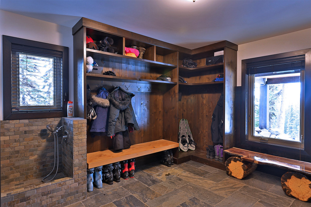 Design ideas for a country mudroom in Vancouver with white walls, slate floors, a single front door, a dark wood front door, grey floor and planked wall panelling.