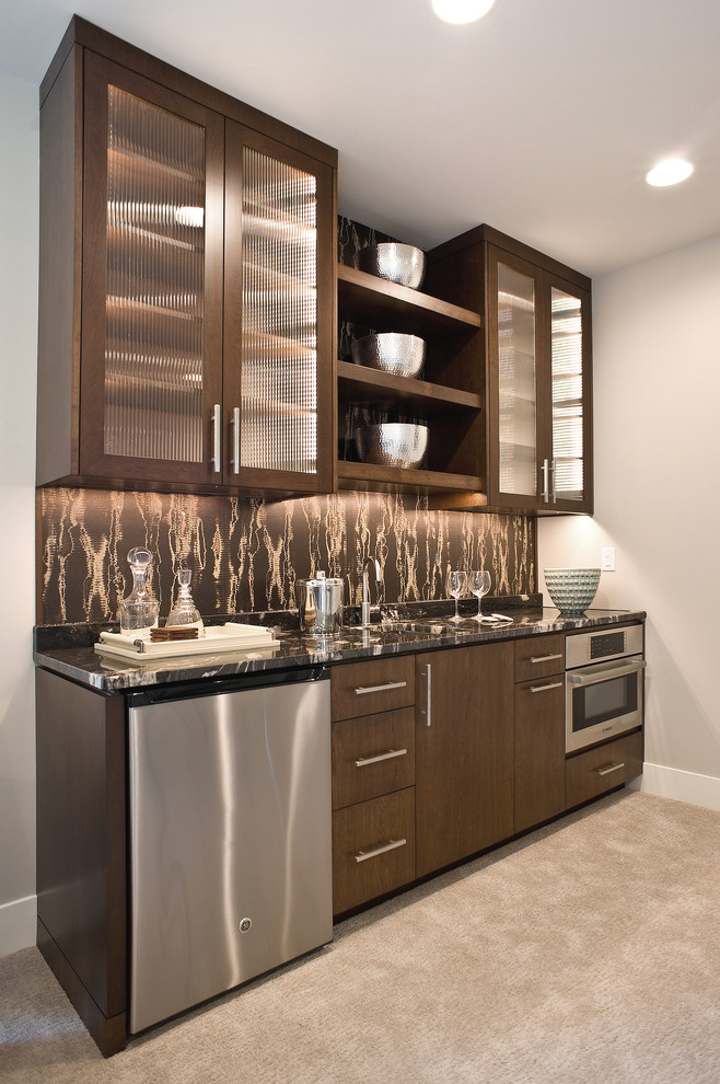 Mid-sized modern single-wall wet bar with an undermount sink, flat-panel cabinets, dark wood cabinets, quartz benchtops, carpet and beige floor.