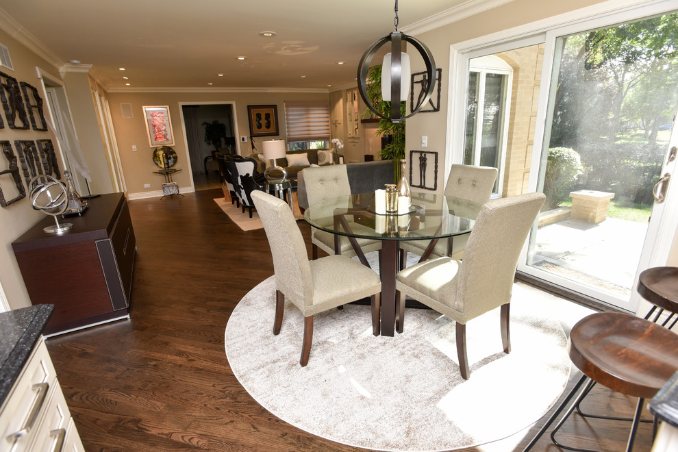 Design ideas for a mid-sized contemporary dining room in Chicago with beige walls and dark hardwood floors.