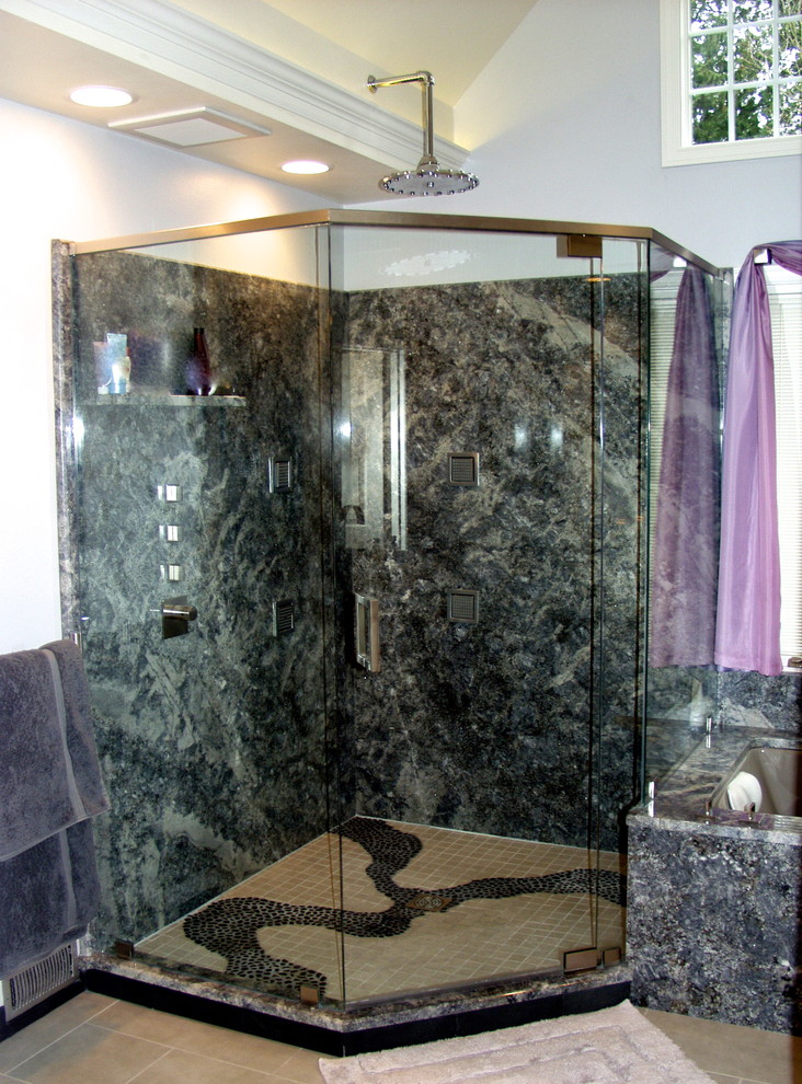 Inspiration for a large transitional master limestone floor corner shower remodel in Seattle with an undermount sink, furniture-like cabinets, granite countertops, an undermount tub, a wall-mount toilet and gray walls