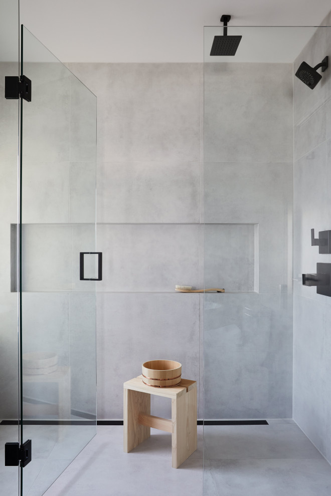 Example of a mid-sized eclectic master gray tile and ceramic tile porcelain tile, gray floor, double-sink and wall paneling bathroom design in Vancouver with flat-panel cabinets, dark wood cabinets, a bidet, gray walls, an integrated sink, concrete countertops, a hinged shower door, gray countertops and a built-in vanity