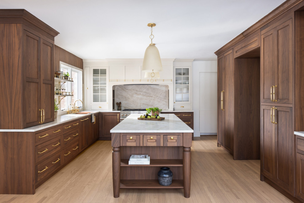 Example of a large transitional u-shaped dark wood floor and brown floor eat-in kitchen design in DC Metro with an undermount sink, shaker cabinets, brown cabinets, quartzite countertops, gray backsplash, quartz backsplash, stainless steel appliances, an island and beige countertops