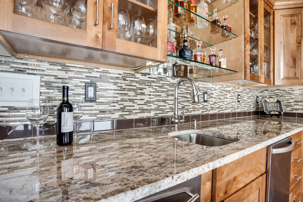 Large mountain style kitchen photo in DC Metro with an undermount sink, raised-panel cabinets, granite countertops, glass tile backsplash, stainless steel appliances and an island
