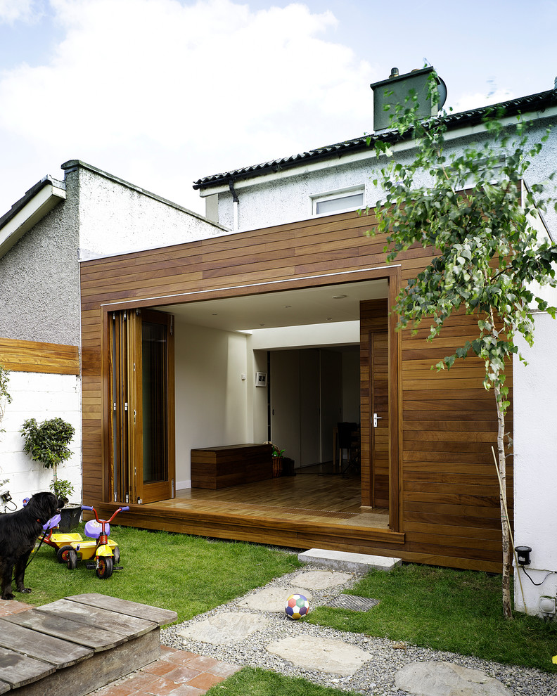Inspiration for a modern exterior in Dublin with wood siding.