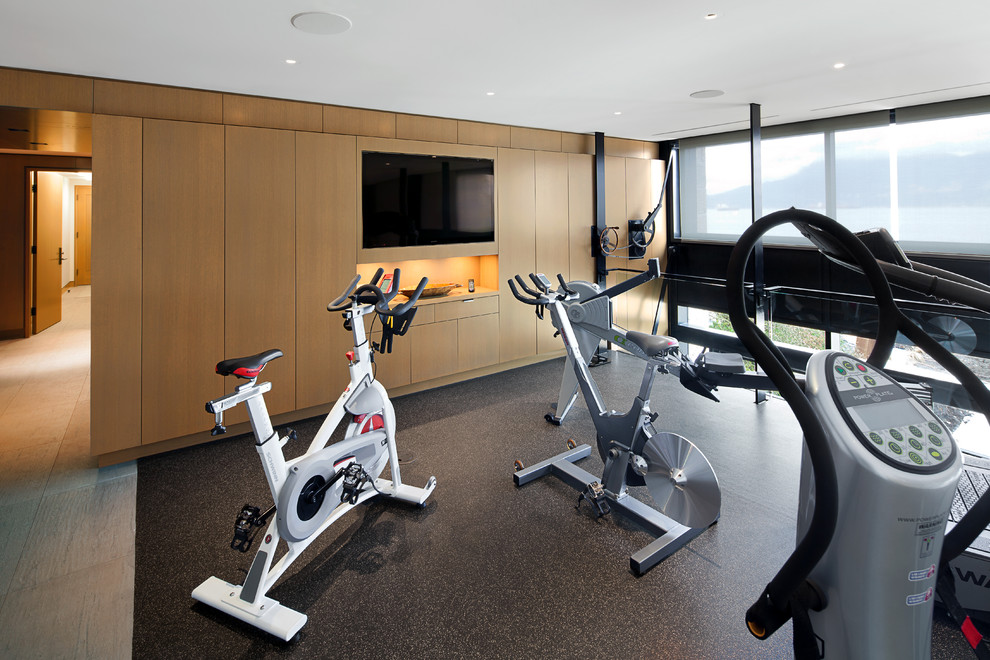 Inspiration for a large contemporary multipurpose gym in Vancouver with beige walls and vinyl floors.