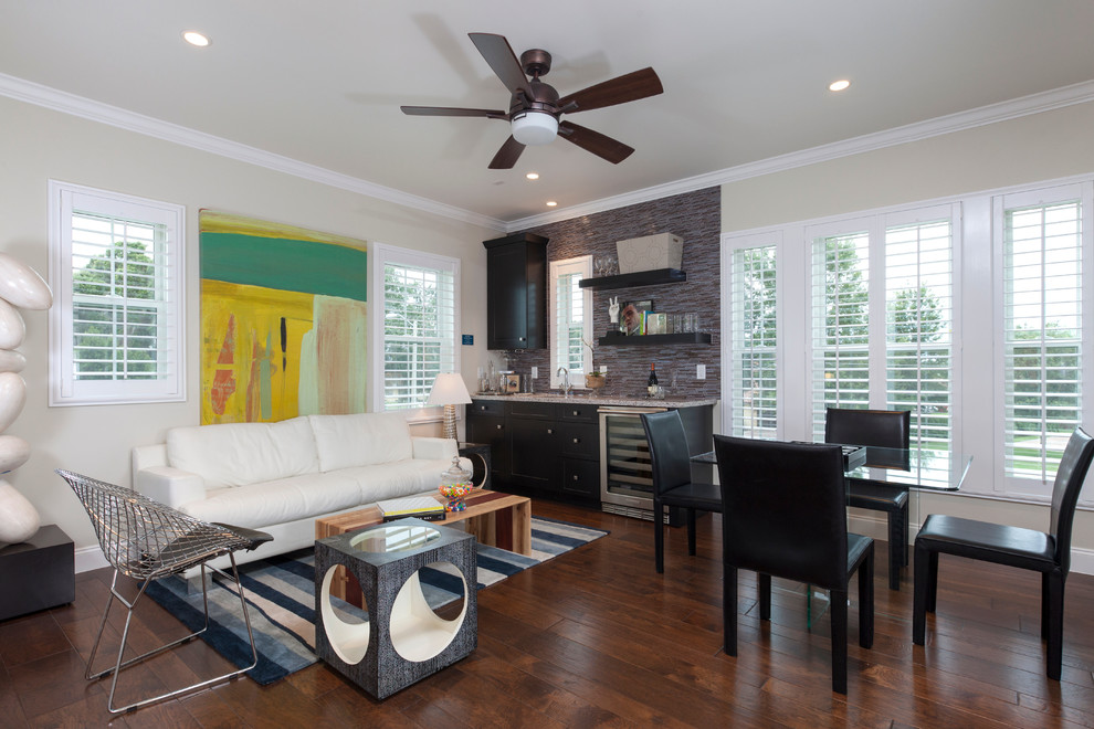 This is an example of a transitional family room in Tampa with a home bar.