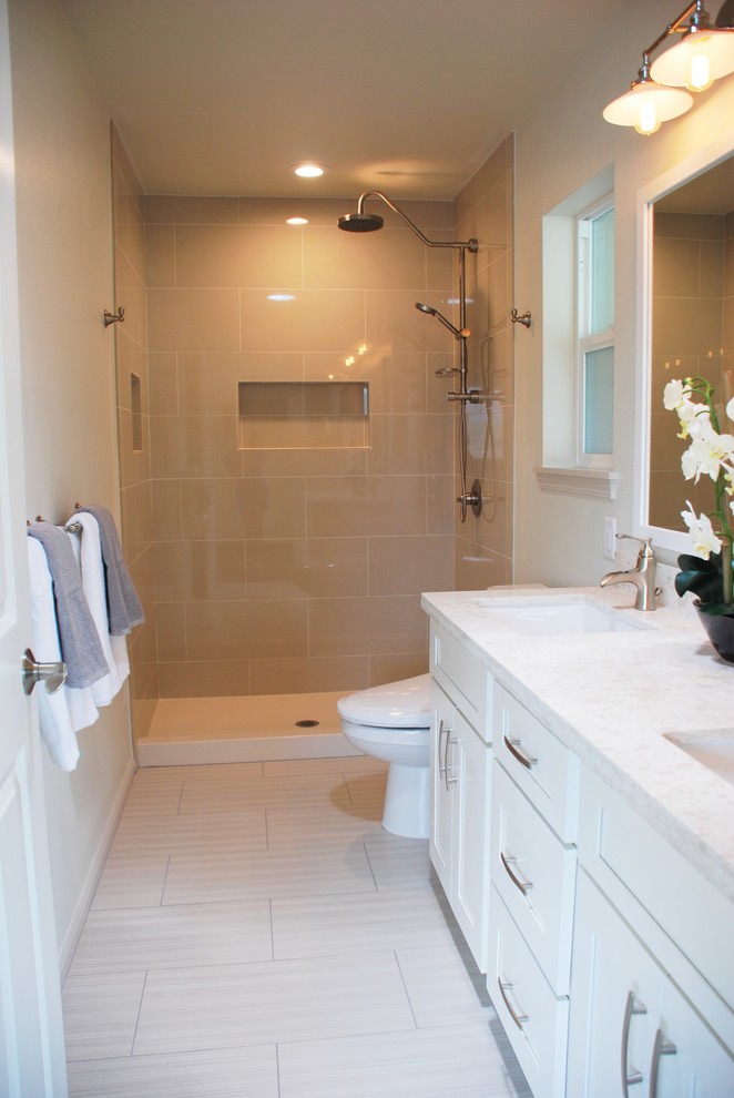Mid-sized transitional master bathroom in Hawaii with shaker cabinets, white cabinets, an alcove shower, a one-piece toilet, brown tile, green walls, vinyl floors, an undermount sink and engineered quartz benchtops.