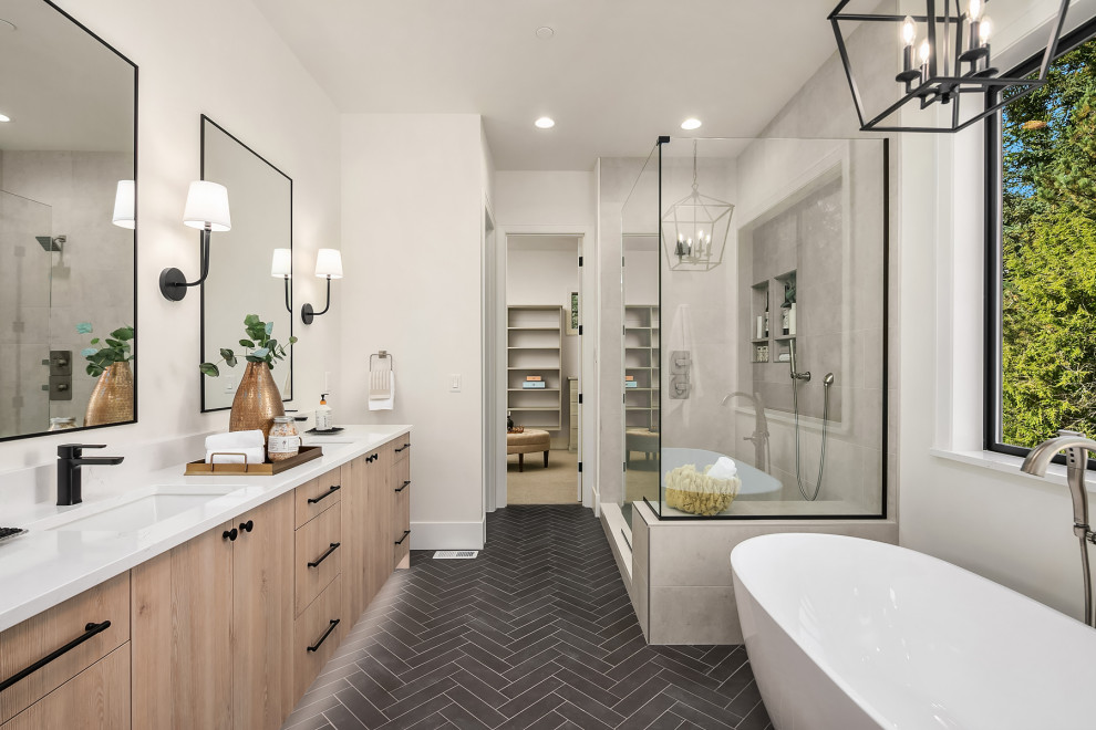 Large arts and crafts master bathroom in Seattle with a freestanding tub, an undermount sink, black floor, a hinged shower door, yellow benchtops, a niche, a double vanity and a freestanding vanity.