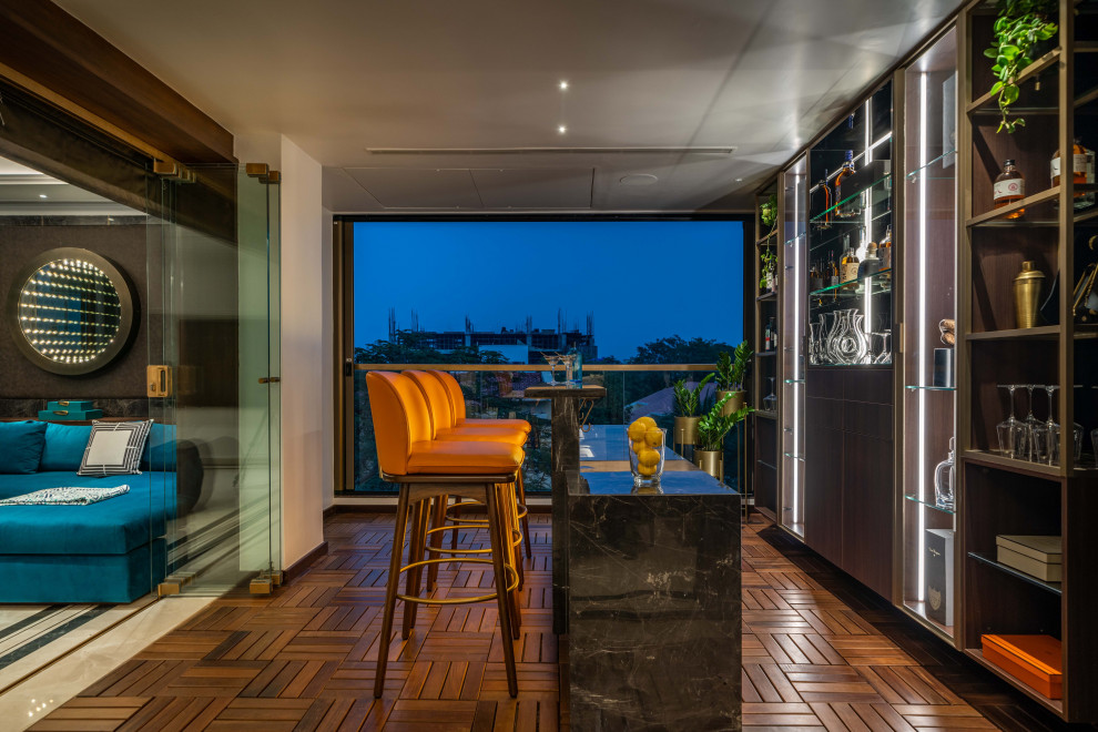 Inspiration for a contemporary Galley home bar With Flat-panel Cabinets, Dark Wood Cabinets and Dark Hardwood Floors.