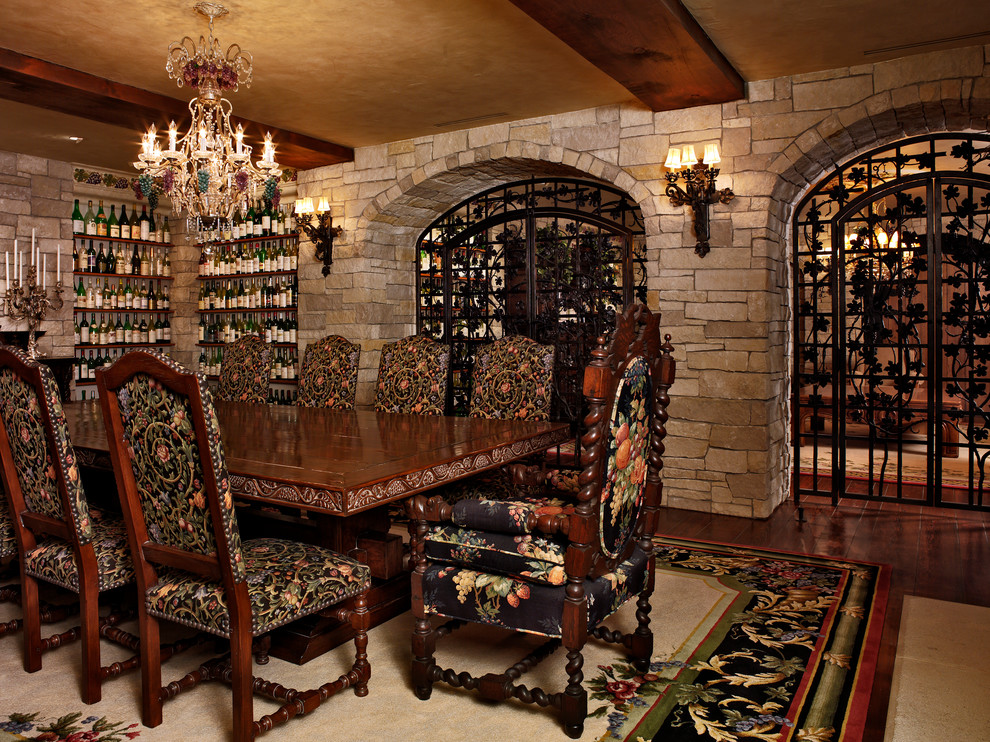 Design ideas for an expansive traditional wine cellar in Denver with dark hardwood floors and display racks.