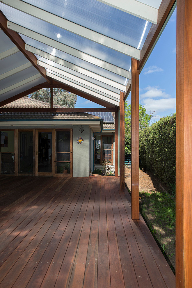 Inspiration for a mid-sized traditional backyard deck in Canberra - Queanbeyan with a pergola.
