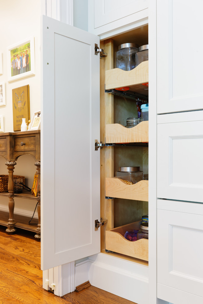 Transitional medium tone wood floor eat-in kitchen photo in Cincinnati with an undermount sink, recessed-panel cabinets, white cabinets, quartzite countertops, white backsplash, subway tile backsplash and paneled appliances
