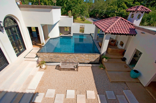 This above ground pool is unique as it is bricked into this villa style home. This is an atypical example of an above ground pool, but is is an interesting idea.