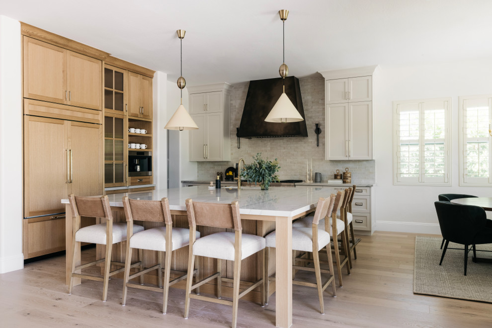 Open concept kitchen - transitional l-shaped open concept kitchen idea in Phoenix with an island