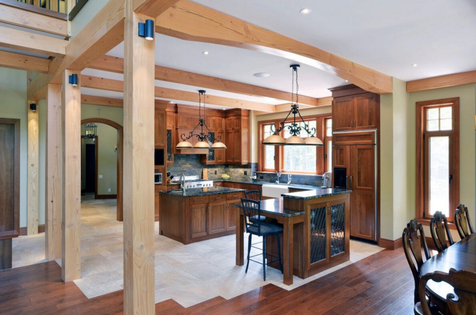 Open concept kitchen - large rustic galley dark wood floor open concept kitchen idea in Boston with an undermount sink, shaker cabinets, white cabinets, granite countertops, stainless steel appliances and an island