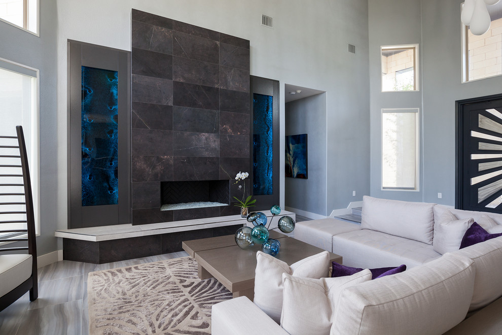 Large contemporary formal open concept living room in Dallas with white walls, ceramic floors, a standard fireplace, a tile fireplace surround and no tv.