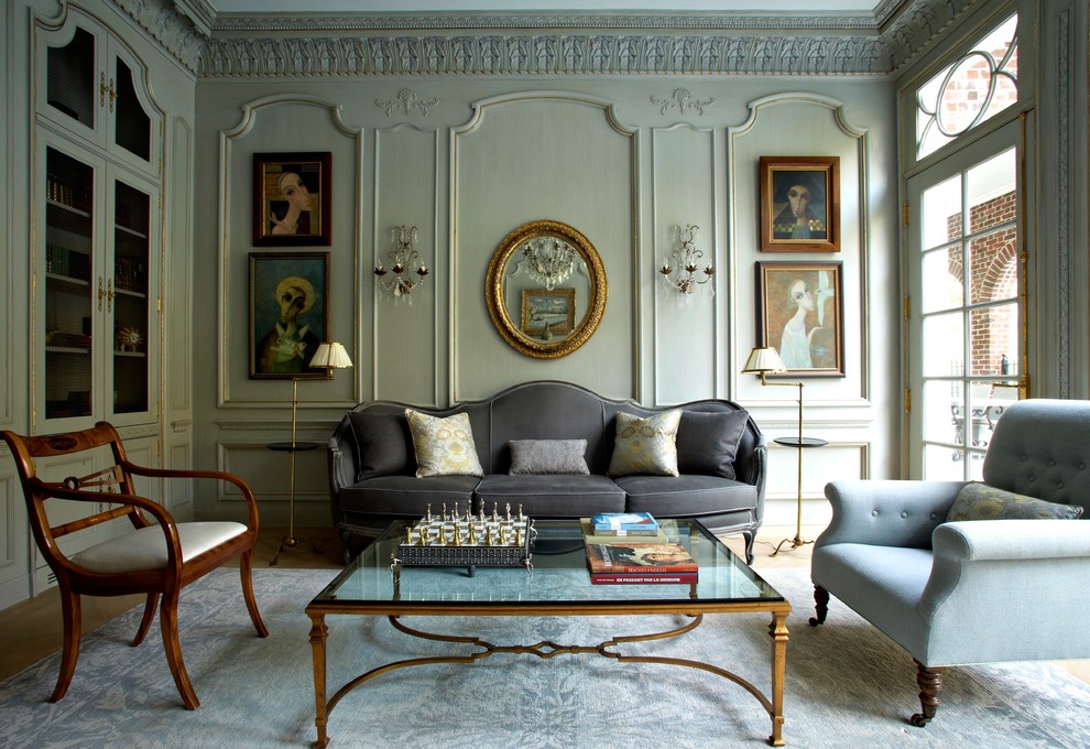 Example of a large classic formal and enclosed medium tone wood floor living room design with green walls and no tv