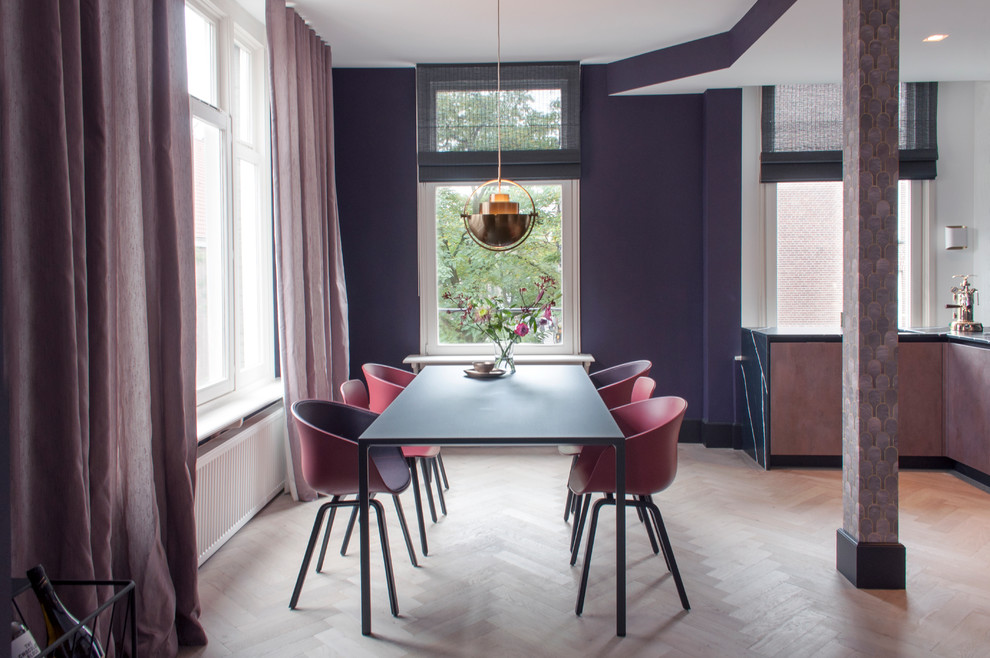 Inspiration for a contemporary dining room in Amsterdam with purple walls, light hardwood floors, no fireplace and beige floor.