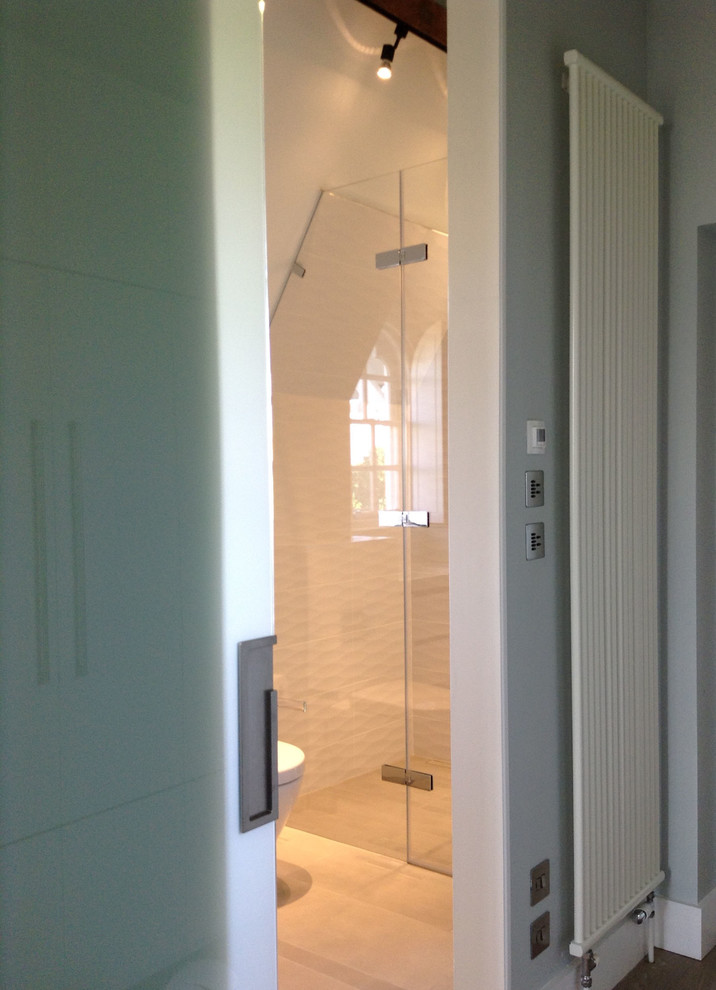 Small transitional master bathroom in St Louis with white tile, ceramic tile and porcelain floors.