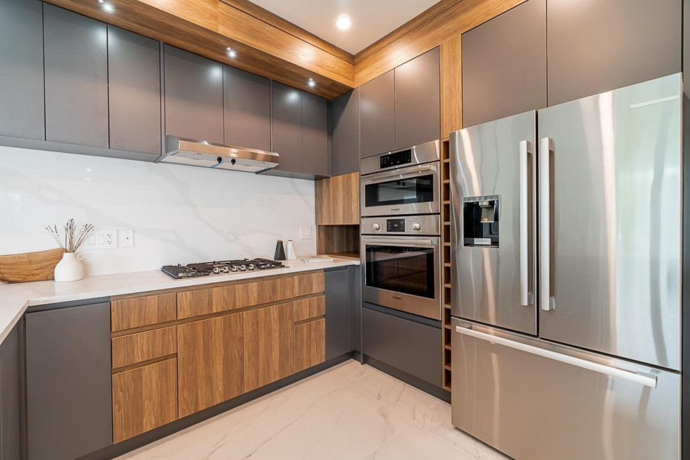 Example of a mid-sized transitional u-shaped ceramic tile and white floor open concept kitchen design in Vancouver with an undermount sink, flat-panel cabinets, dark wood cabinets, quartzite countertops, white backsplash, ceramic backsplash, stainless steel appliances, white countertops and no island