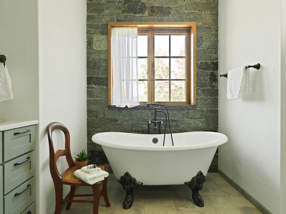 Inspiration for a mid-sized country master bathroom in Burlington with shaker cabinets, green cabinets, a claw-foot tub, beige floor, green tile, stone tile, white walls, travertine floors and white benchtops.