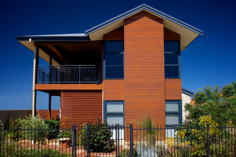 Design ideas for a mid-sized contemporary two-storey brick beige exterior in Perth with a gable roof.