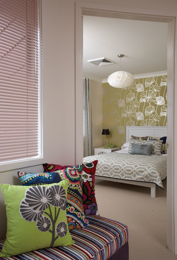 Design ideas for a mid-sized midcentury guest bedroom in Sydney with white walls and carpet.