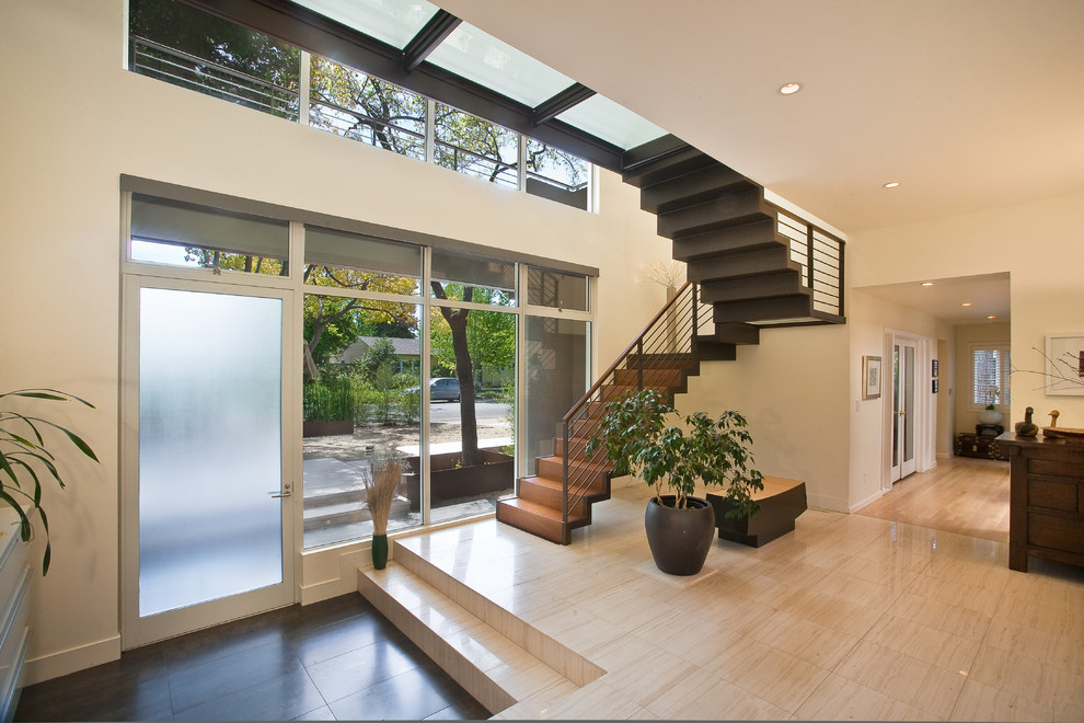 Photo of a contemporary entryway in San Francisco with a single front door and a glass front door.