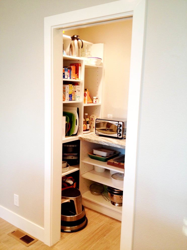 Example of a mid-sized transitional l-shaped light wood floor open concept kitchen design with a double-bowl sink, shaker cabinets, white cabinets, white backsplash, subway tile backsplash, stainless steel appliances and an island