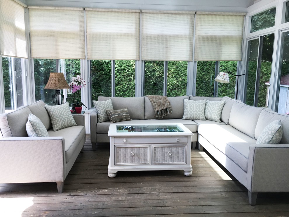 Photo of a mid-sized traditional sunroom in Montreal with dark hardwood floors, a standard ceiling and brown floor.
