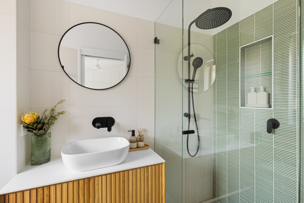 Small modern 3/4 bathroom in Sydney with light wood cabinets, an alcove shower, a one-piece toilet, green tile, mosaic tile, white walls, a vessel sink, grey floor, a hinged shower door, white benchtops, a niche, a single vanity and a floating vanity.