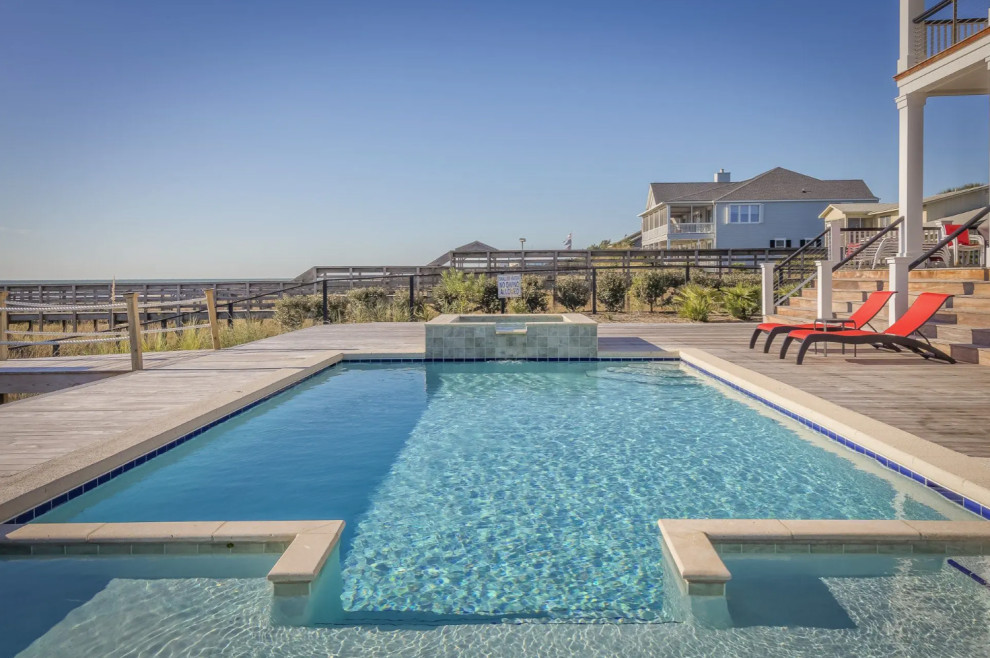 Mid-sized backyard rectangular lap pool photo