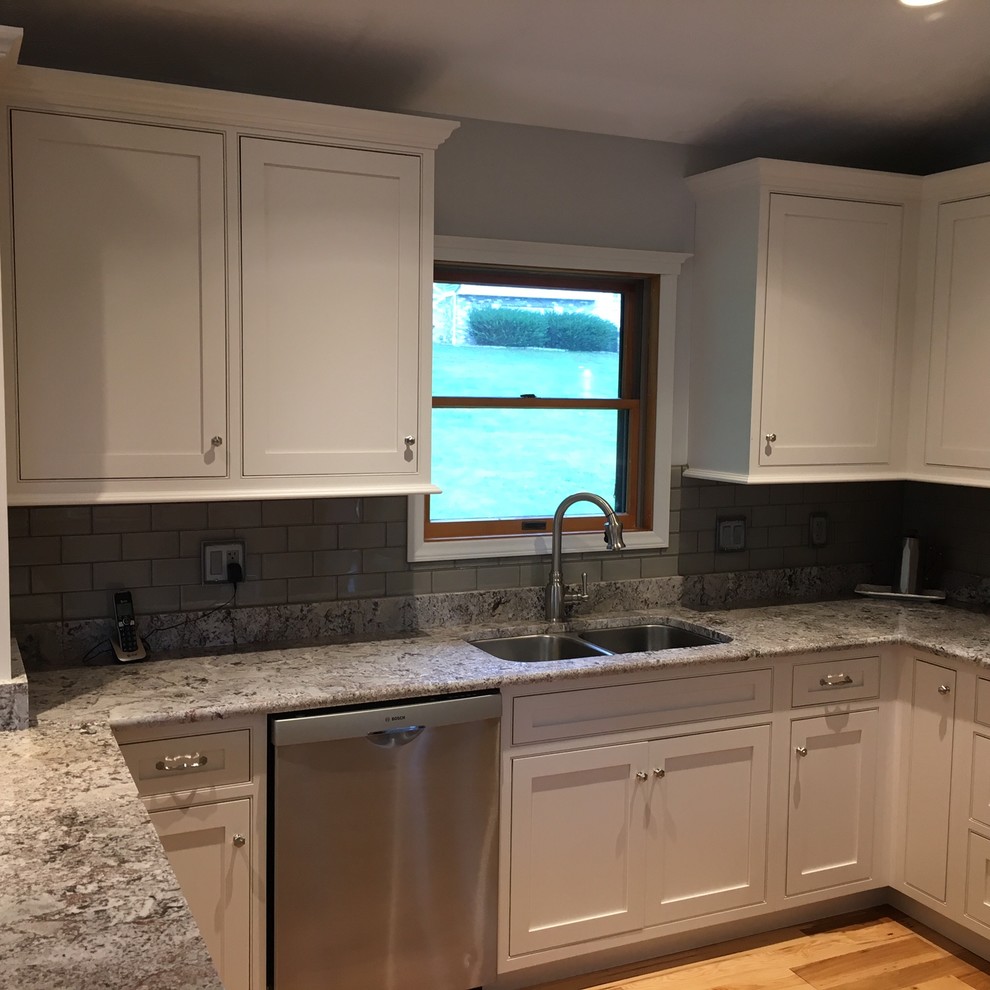 Inspiration for a transitional kitchen remodel with white cabinets and quartz countertops
