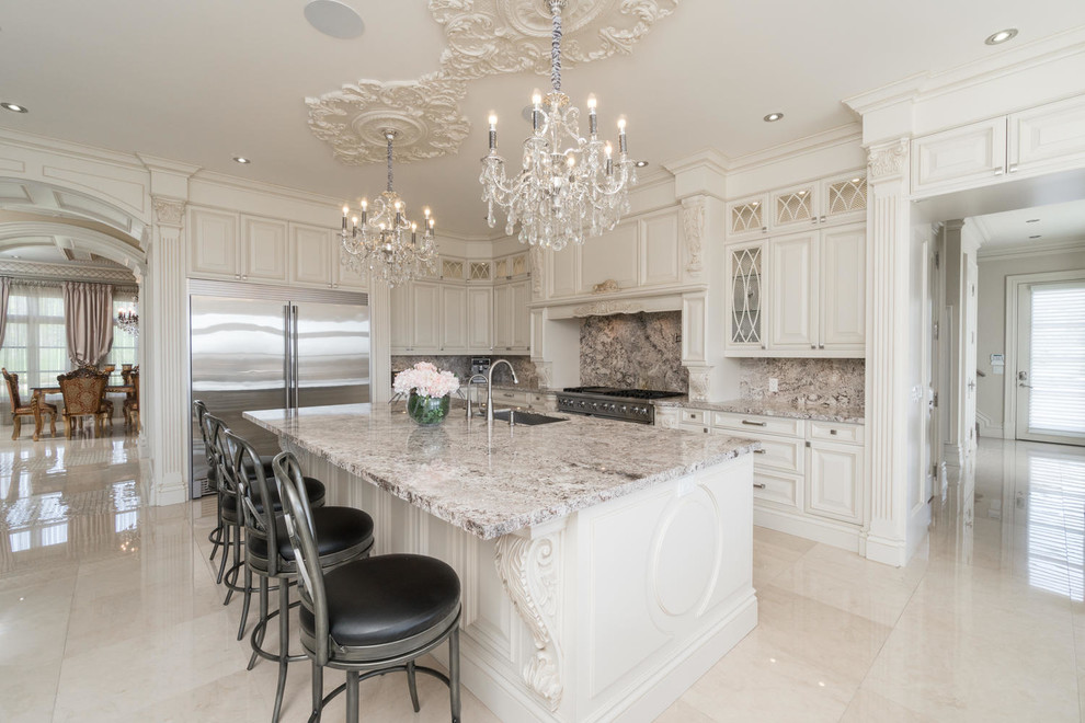 This is an example of a large transitional l-shaped eat-in kitchen in Toronto with a double-bowl sink, raised-panel cabinets, beige cabinets, granite benchtops, multi-coloured splashback, marble splashback, stainless steel appliances, marble floors, with island and blue floor.