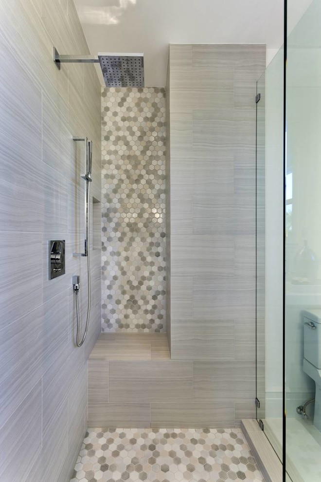 This is an example of a mid-sized contemporary master bathroom in Other with a corner shower, a one-piece toilet, multi-coloured walls, mosaic tile floors, multi-coloured floor and a hinged shower door.