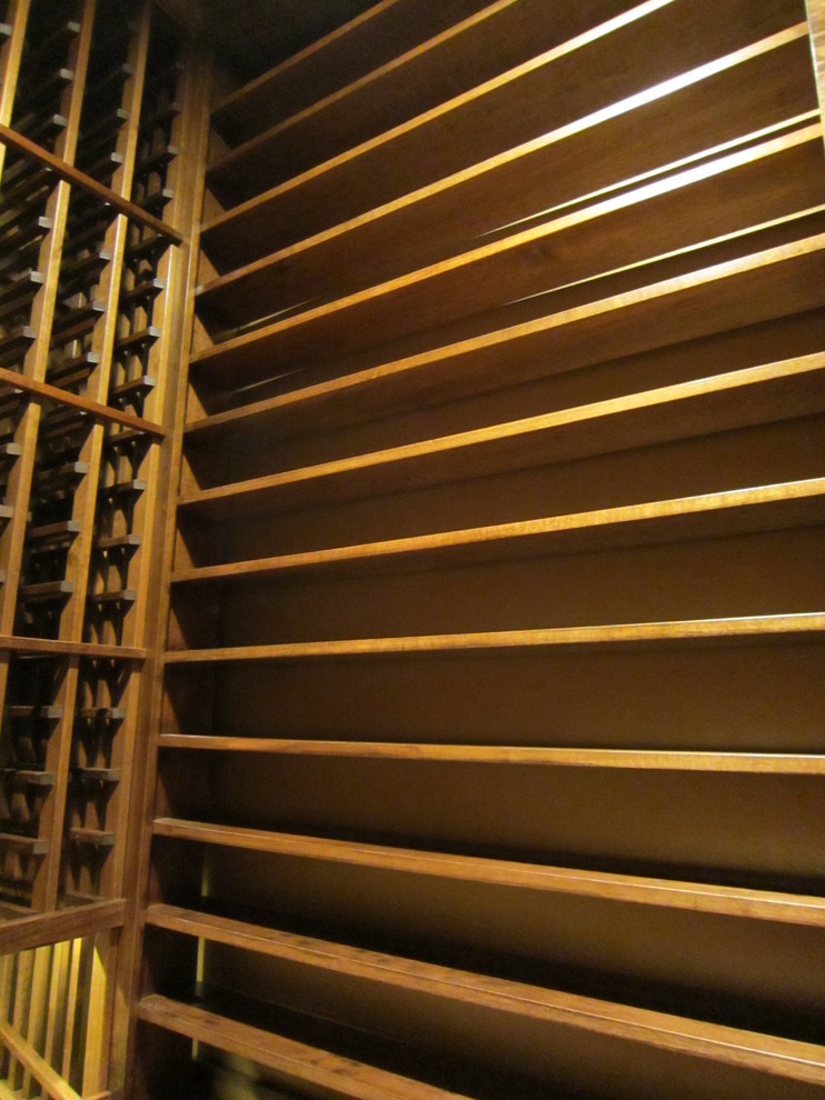 Design ideas for a small traditional wine cellar in Dallas with display racks.