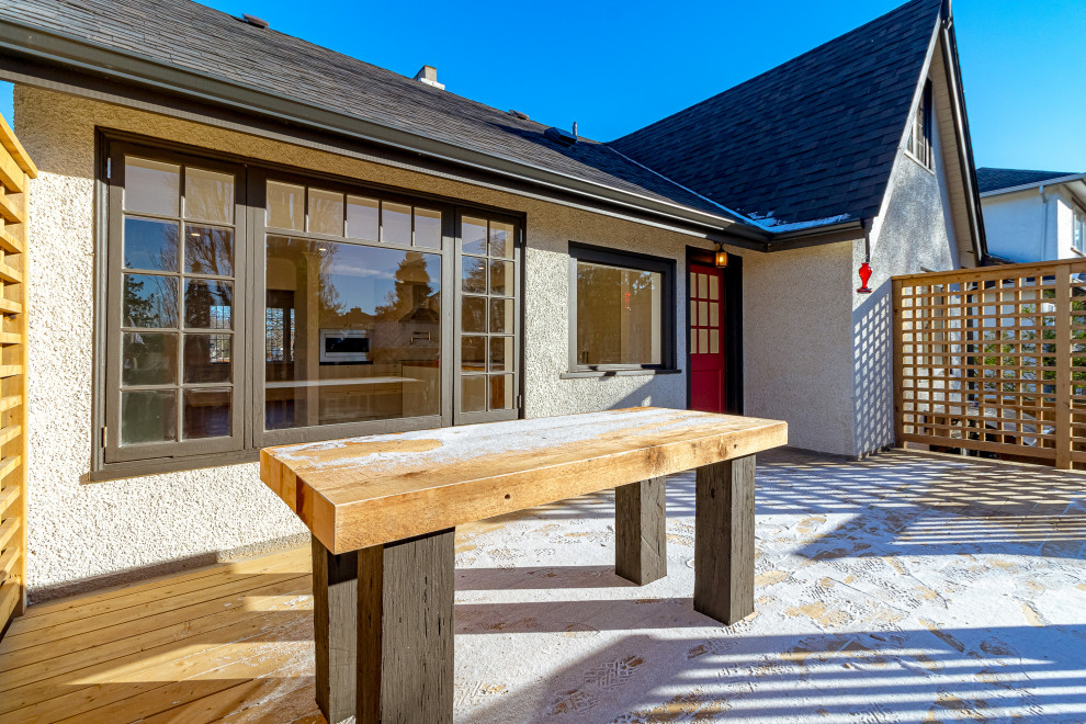 Deck - mid-sized transitional backyard second story privacy and wood railing deck idea