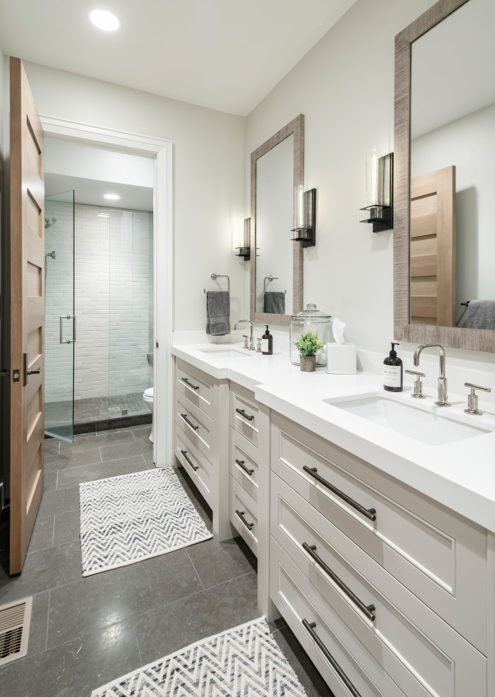 Inspiration for a large country kids bathroom in Salt Lake City with beige cabinets, an alcove shower, white tile, ceramic floors, an undermount sink, engineered quartz benchtops, grey floor, a hinged shower door, white benchtops, recessed-panel cabinets, grey walls and a double vanity.
