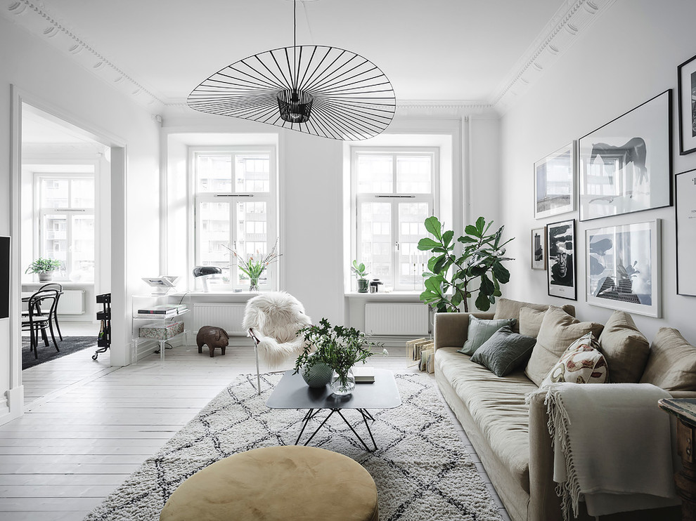 Design ideas for a scandinavian living room in Gothenburg with white walls, painted wood floors and white floor.