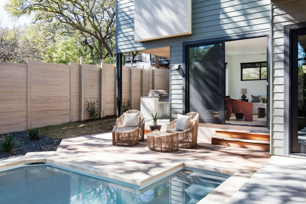 Photo of a modern backyard pool in Austin.