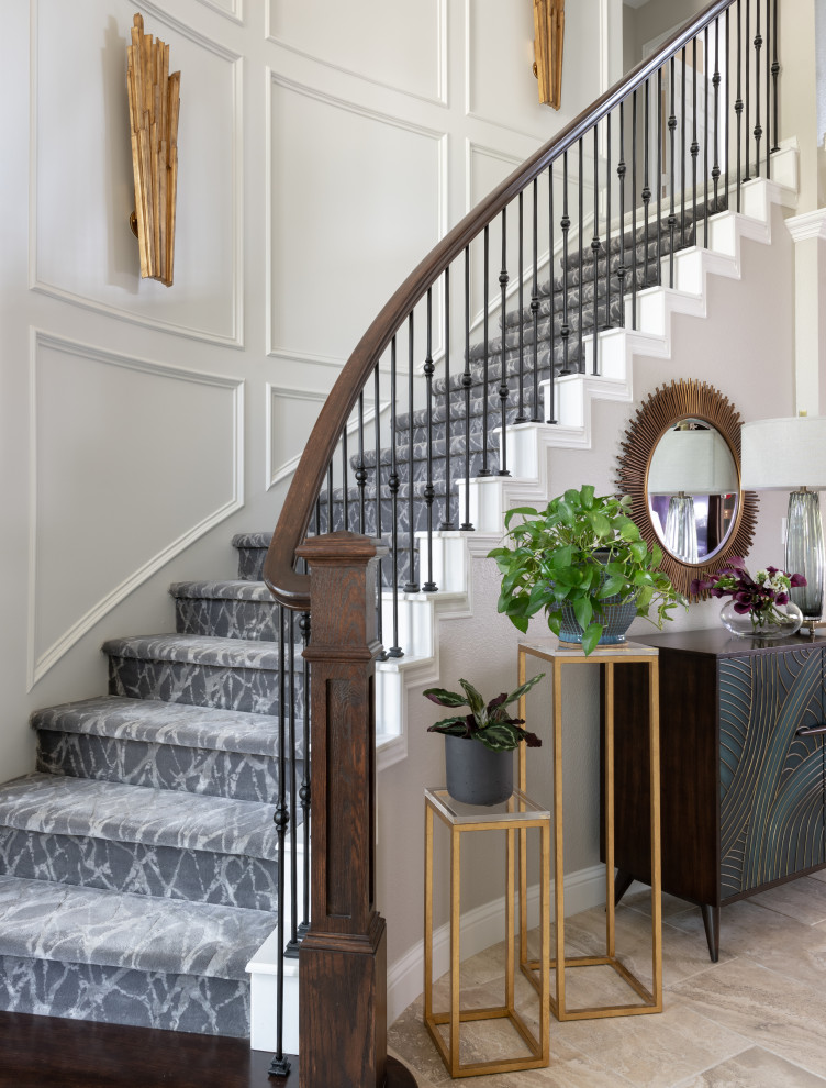Inspiration for a mid-sized transitional carpeted curved staircase in Dallas with carpet risers, wood railing and panelled walls.
