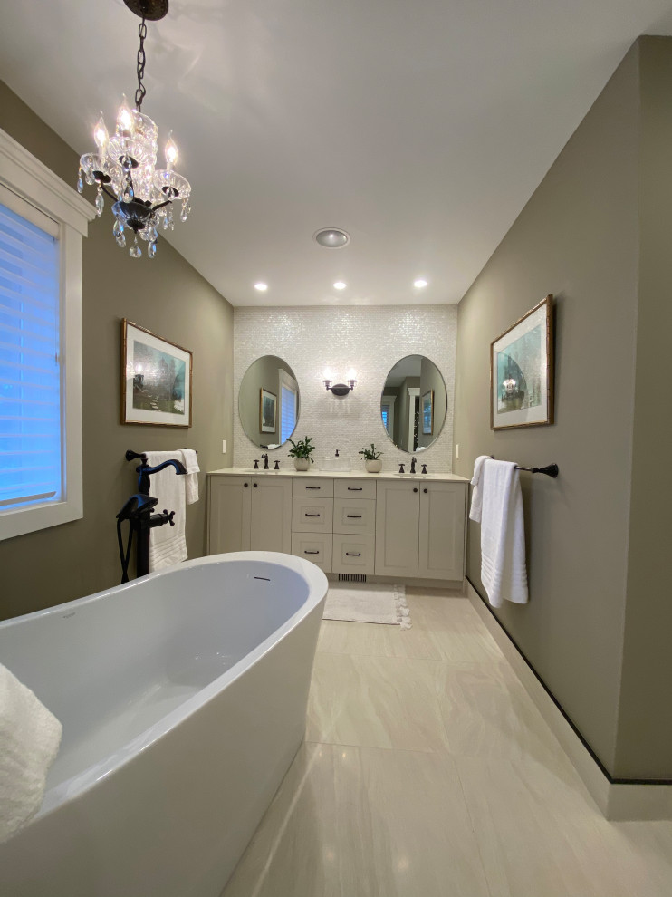 This is an example of a large traditional master bathroom in Calgary with shaker cabinets, white cabinets, beige tile, engineered quartz benchtops, beige benchtops, a double vanity and a built-in vanity.