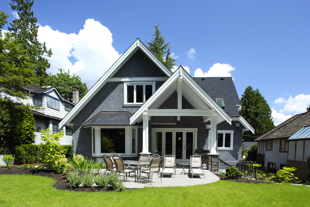 Photo of a traditional two-storey grey exterior in Vancouver.
