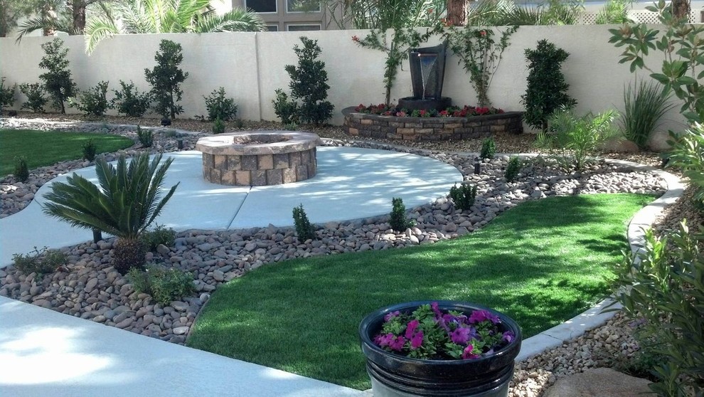 Backyard xeriscape in Las Vegas with a fire feature and gravel.