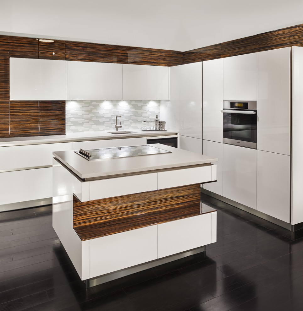 Modern l-shaped kitchen in New York with an undermount sink, flat-panel cabinets, white cabinets, stainless steel appliances, dark hardwood floors and with island.