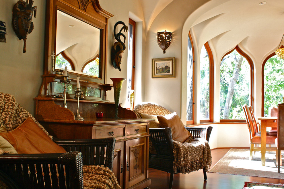 Photo of an eclectic living room in Santa Barbara with beige walls and dark hardwood floors.