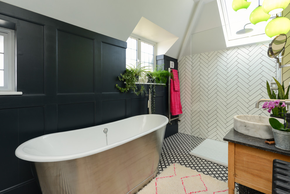 Photo of a mid-sized contemporary bathroom in Kent with ceramic floors, a vessel sink, multi-coloured floor, an open shower, light wood cabinets, a freestanding tub and white tile.
