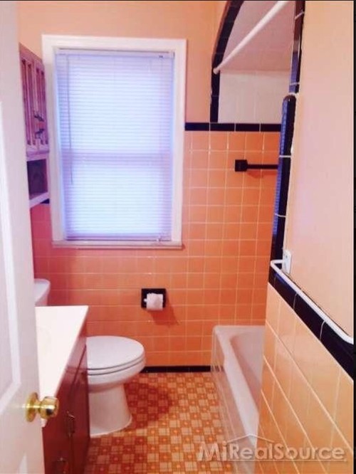 Peach & black tile bathroom